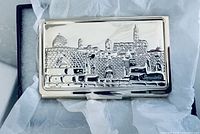 Front of silver card holder showing Jerusalem relief