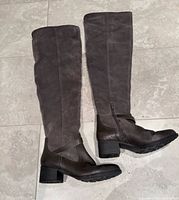 Full view of both boots showing leather foot, suede shaft, block heel