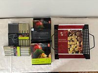 Group shot of grill basket, three skewer packs, two visible kebab plate sets