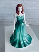 Figurine on display showing front detail of gown and crystal