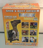 Front of boxed MaxxDry XL shoe & boot dryer showing branding and key claims