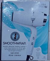 Front of sealed retail box showing Smoothwrap hair dryer image and branding