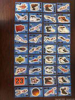 30 blue-backed die-cut sticker cards displayed on table