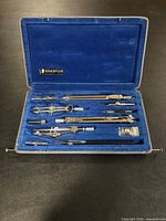 open case showing all drafting instruments