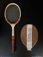 Front view of Wilson Lady Advantage racquet alongside cover