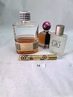 Group shot of all four fragrance bottles