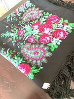 Folded view of shawl with floral print detail