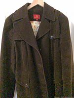 front view of dark brown Cole Haan wool coat on hanger