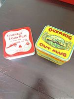 Both tins side by side showing lids and overall appearance.