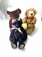 Group shot of the three Dean's Rag Book limited edition teddy bears with accessories visible