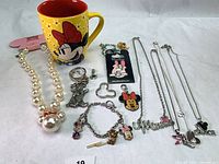 Group shot of mug, jewelry and accessories