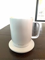 Ember mug on charging coaster showing exterior condition