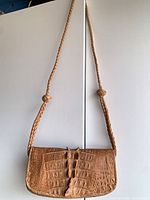 Full view of bag hanging to show overall design, strap and size