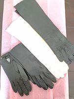 Group of four glove pairs: long black, long ivory, two short black