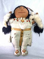 Full view of doll showing attire and size