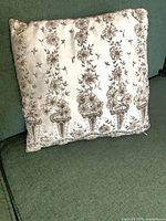 Front view of pillow showing full embroidered design and overall condition