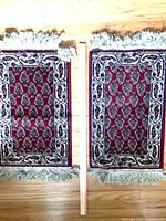 Front view of both rugs showing pattern, colours, fringe, yardstick for scale