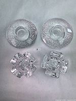 Top view of all four Orrefors crystal candle holders