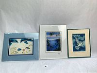 Front view of three matted prints