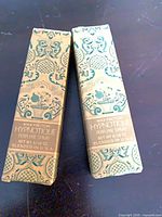 Front view of two patterned boxes labeled Max Factor Hypnotique Perfume Spray 5/16 oz