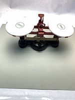 Full view of CENCO balance scale showing both porcelain pans and cast iron base