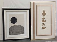 Both framed prints side by side