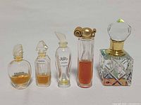 Group shot of all five perfume bottles