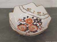 Interior view showing floral pattern and scalloped rim