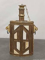 Front view showing geometric bone inlays, stopper detail