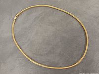 Entire necklace laid flat to show full length and clasp