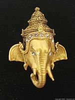 Front view of gold-tone Ganesha pendant