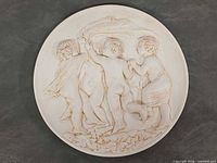 Full view of round plaster plaque showing entire design and diameter proportion