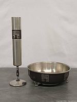 Bowl and vase front view showing size, finish, relief motifs, feet