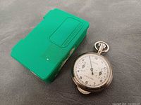Opisometer and green case front view