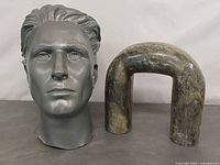 Front view of mannequin head and soapstone arch