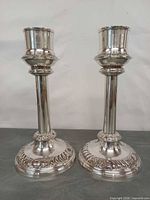 Front view of both candle holders standing side by side
