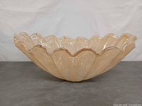 Side view of scalloped Murano art glass bowl