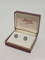 Closed maroon Adirna Jewellery box displaying both pearl earrings