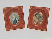 Both leather-framed portraits front view