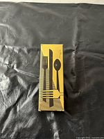 Closed original box with utensil graphics