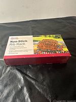 Front of box showing Grand Gourmet Non-Stick Rib Rack label