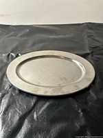 front of oval aluminum platter, shows surface condition