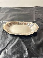 Top view of Oneida scalloped oval tray showing overall shape and finish