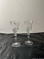 Full view of both crystal wine glasses front