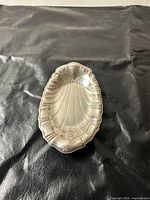Top view of silver-plated shell tray showing overall design and condition