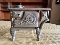 Side view showing IXL logo, scrollwork and legs