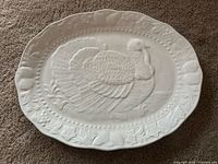 Front view showing embossed turkey and border design