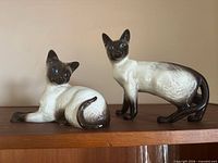 Both Beswick Siamese cat figurines displayed together