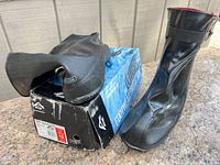 Full view of overshoes with box