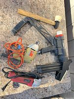 overall view of four tools on stone surface